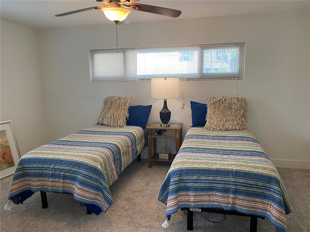 7230 Shepherd Street Sarasota, FL 34243 - Photo 27 of 38 a bedroom with bed and a window