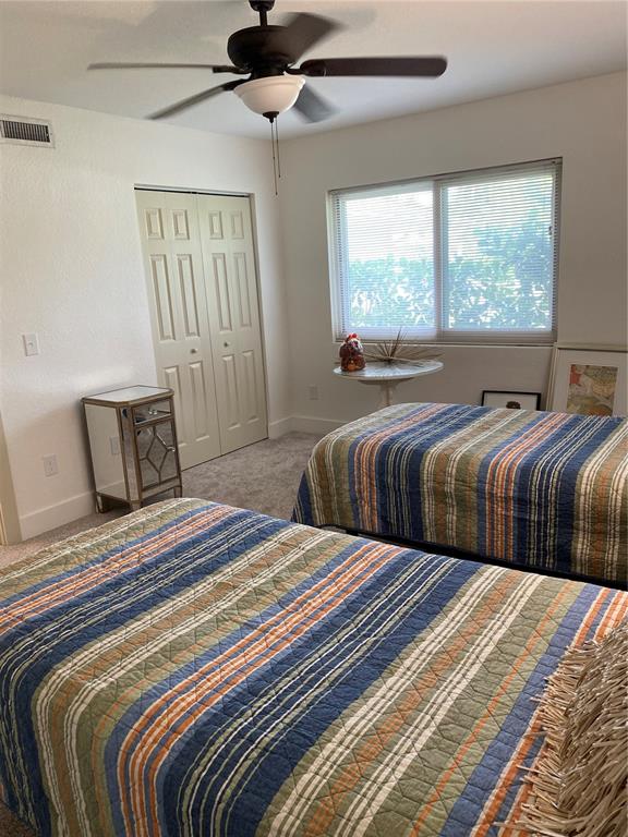 7230 Shepherd Street Sarasota, FL 34243 - Photo 28 of 38 a bedroom with two beds and a large window