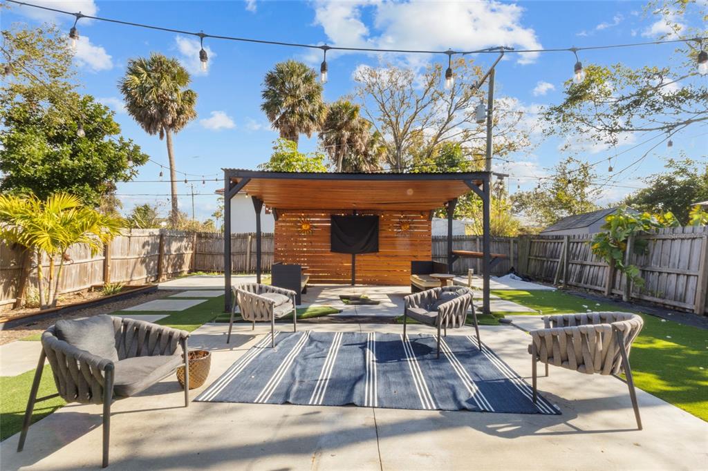 7230 Shepherd Street Sarasota, FL 34243 - Photo 30 of 30 a view of a patio with a table and chairs
