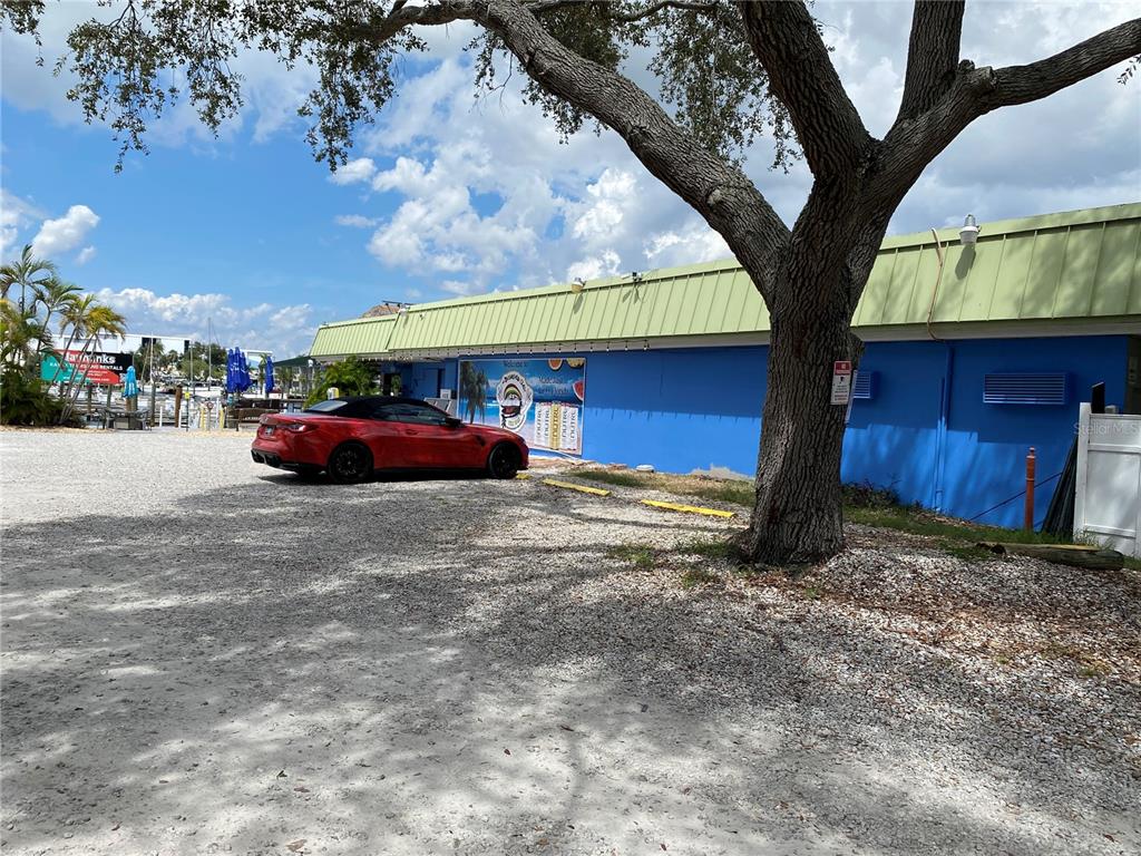 7230 Shepherd Street Sarasota, FL 34243 - Photo 37 of 38 a view of car parked in front of house