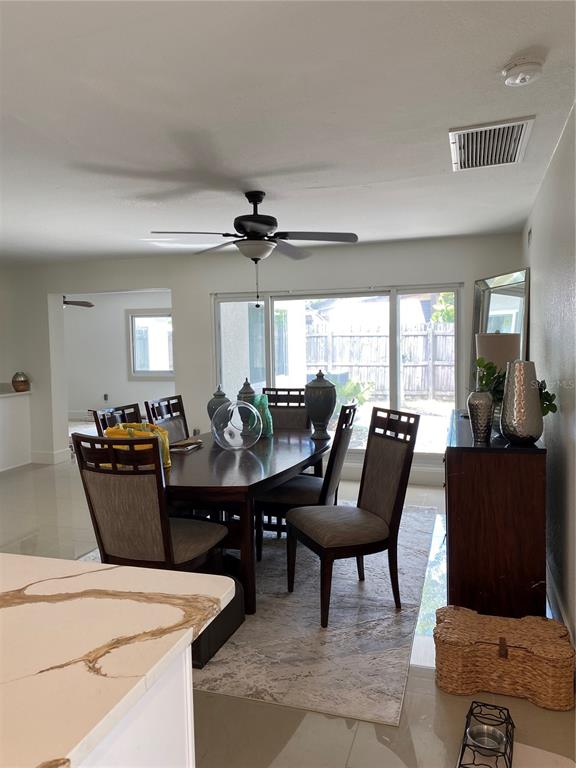 7230 Shepherd Street Sarasota, FL 34243 - Photo 4 of 38 a living room with furniture and a large window