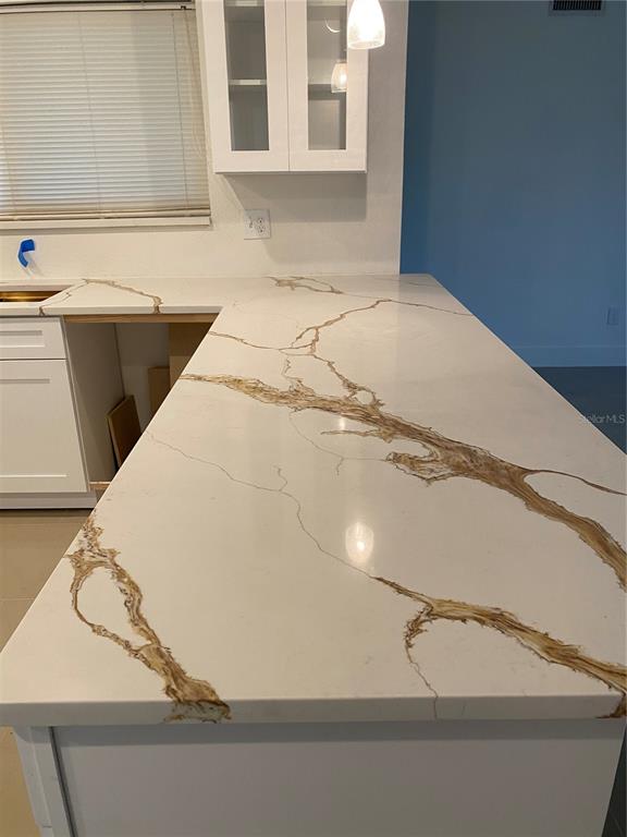 7230 Shepherd Street Sarasota, FL 34243 - Photo 8 of 38 a bathroom with a bathtub and a window