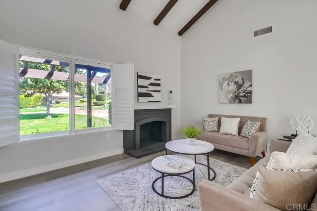 a view of livingroom with furniture and a window