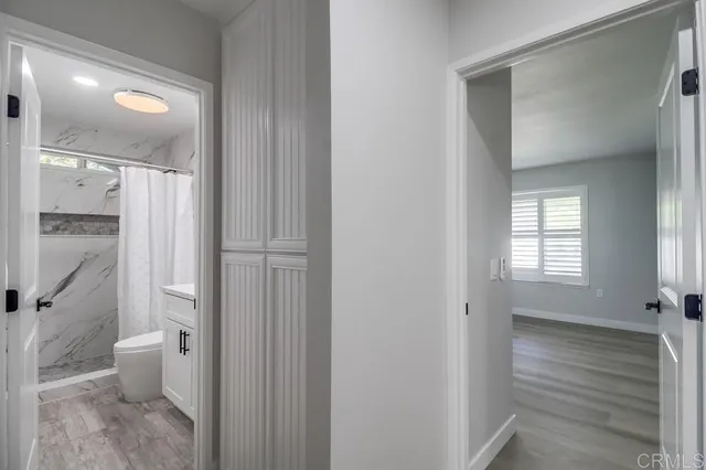 a bedroom with a large bed and a large window