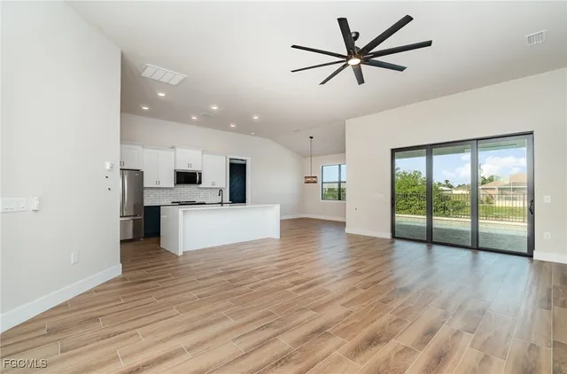 a view of kitchen with cabinets and wooden floor