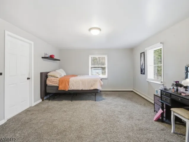 a bed room with a bed and a window