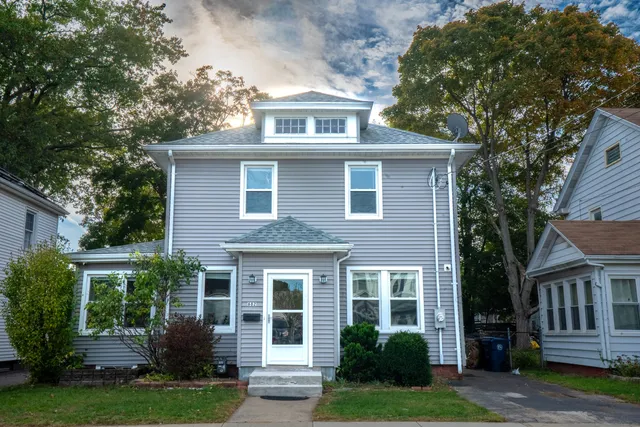 front view of a house with a yard