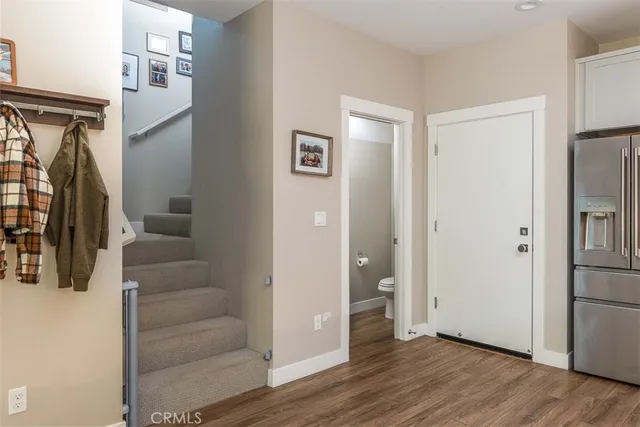 a view of livingroom with hardwood floor and staircase