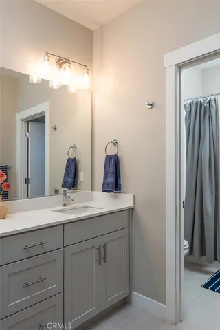 a bathroom with a shower curtain and a bathtub