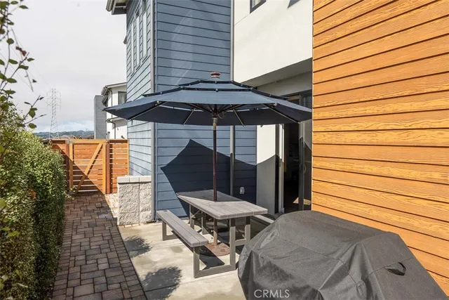 an outdoor space with furniture and umbrella