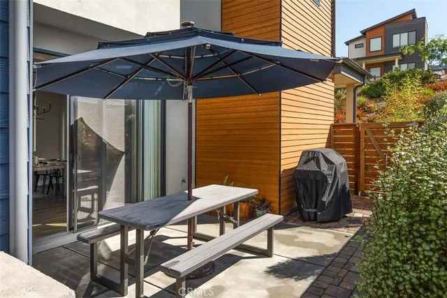 a terrace view with two chairs and a table