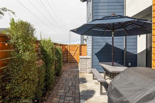 a view of a swimming pool with a yard and plants