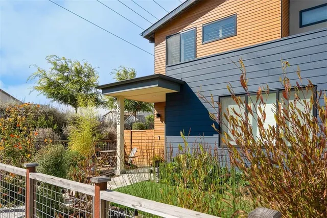 a view of a house with a tree