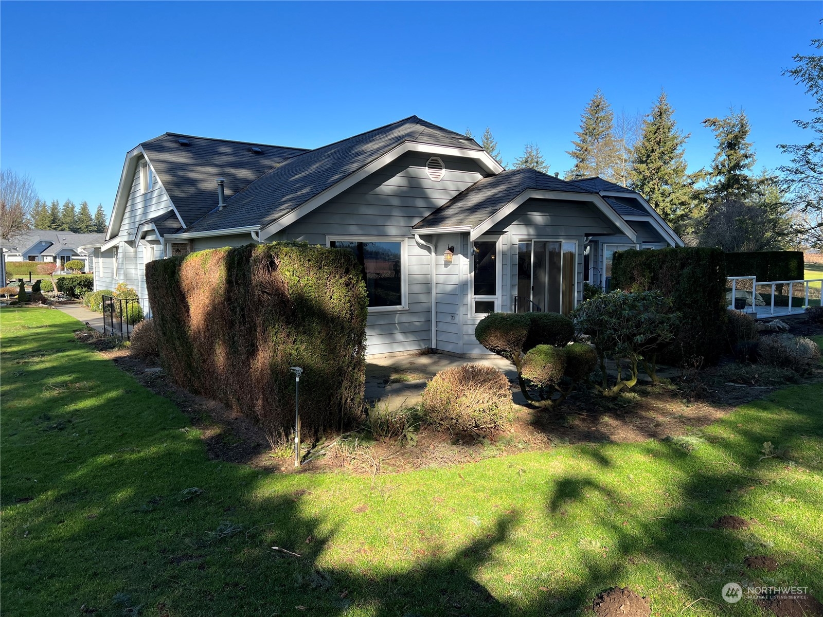6842 Raspberry Dr., Unit A Everson, WA 98247 - Photo 3 of 20 a front view of a house with a yard