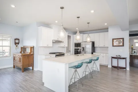 a view of walk in closet with clothes