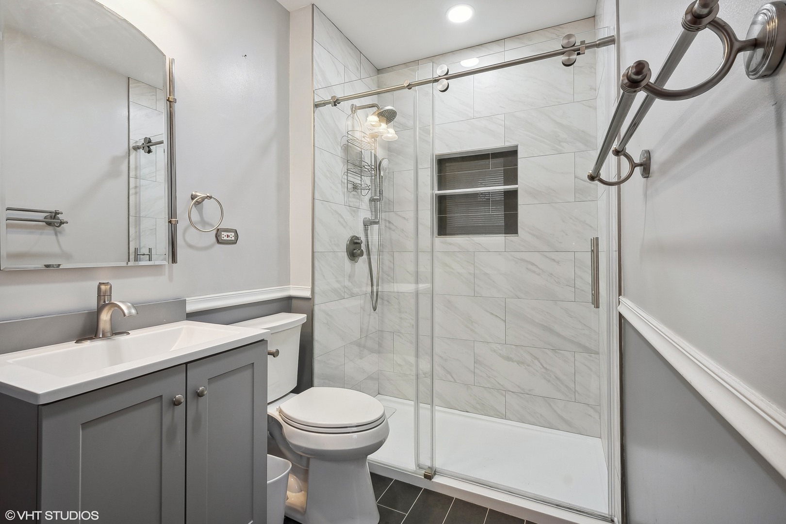 32 East Maple Avenue Roselle, IL 60172 - Photo 12 of 19 a bathroom with a sink a toilet and shower