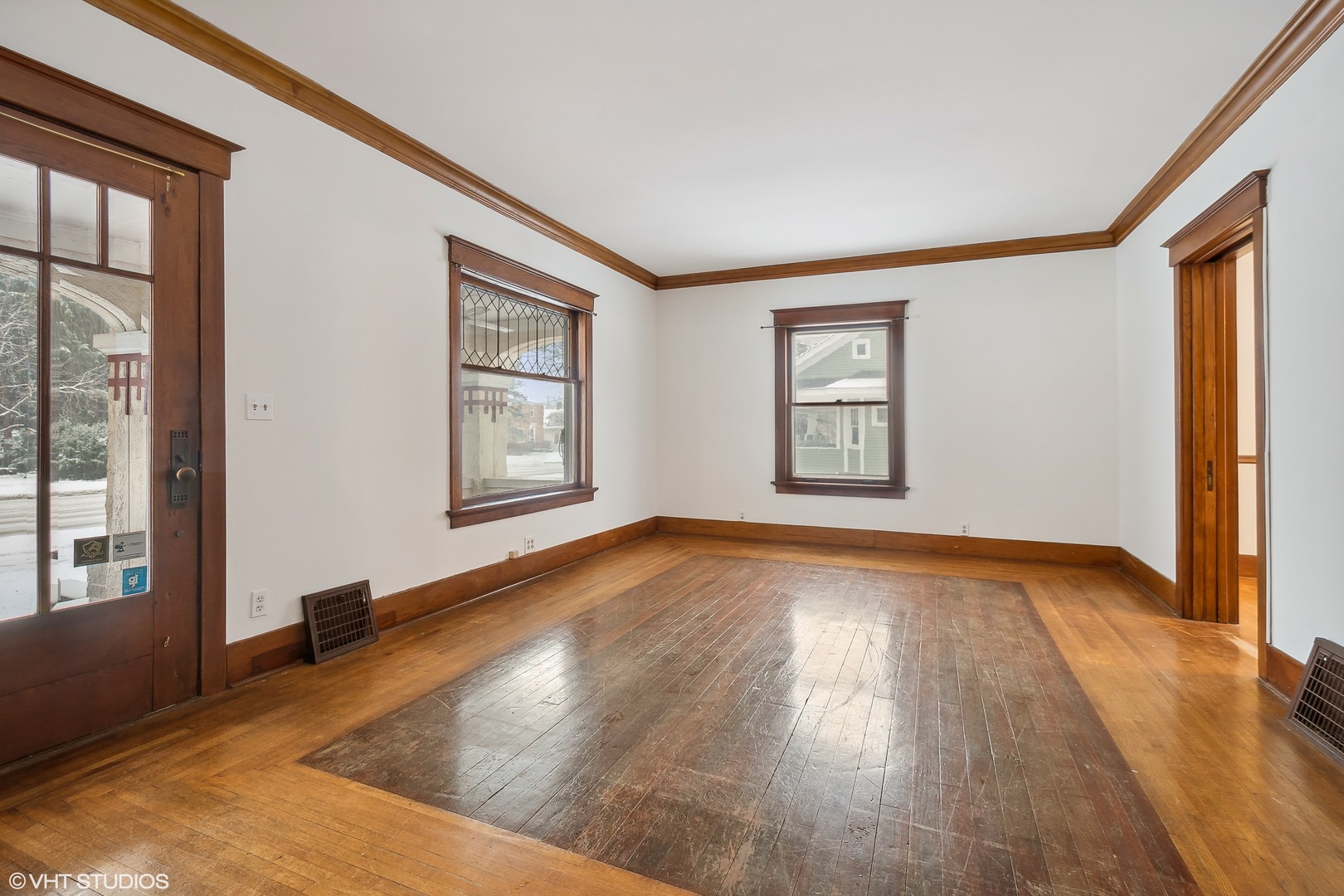 32 East Maple Avenue Roselle, IL 60172 - Photo 3 of 19 an empty room with wooden floor and windows