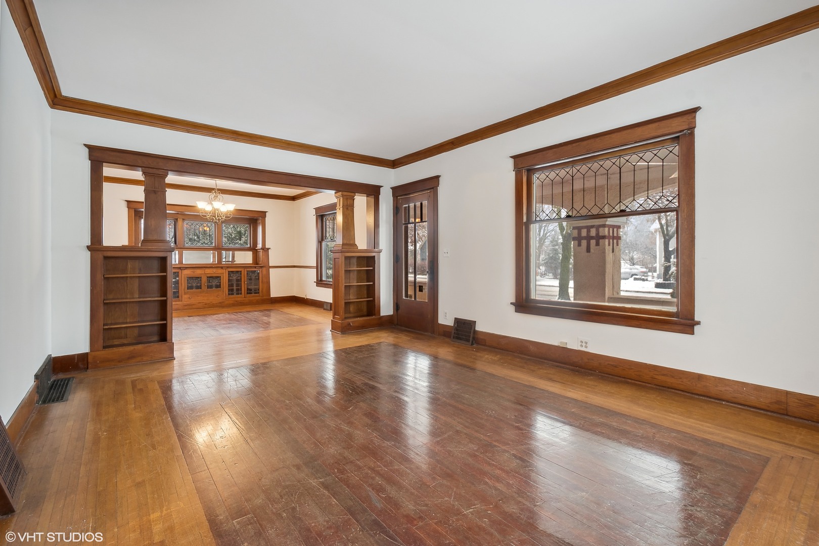 32 East Maple Avenue Roselle, IL 60172 - Photo 4 of 19 a view of an empty room with wooden floor and a window