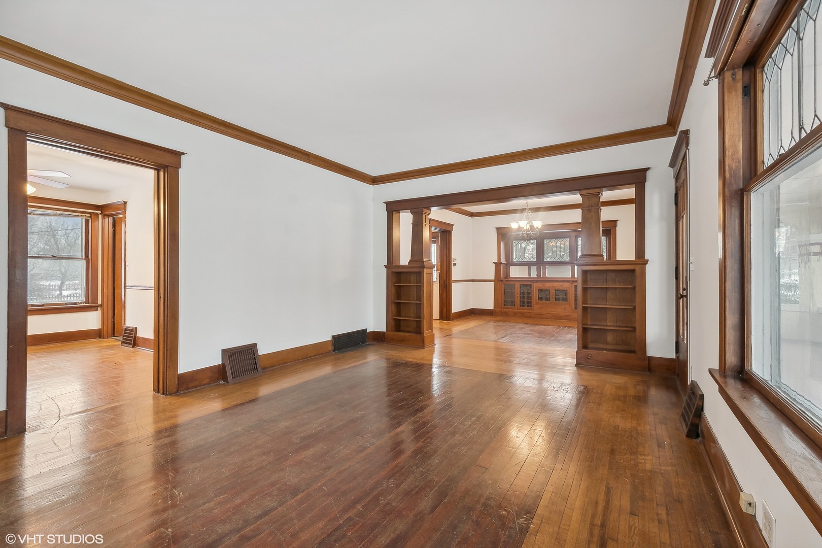 32 East Maple Avenue Roselle, IL 60172 - Photo 5 of 19 a view of empty room with wooden floor and floor to ceiling window