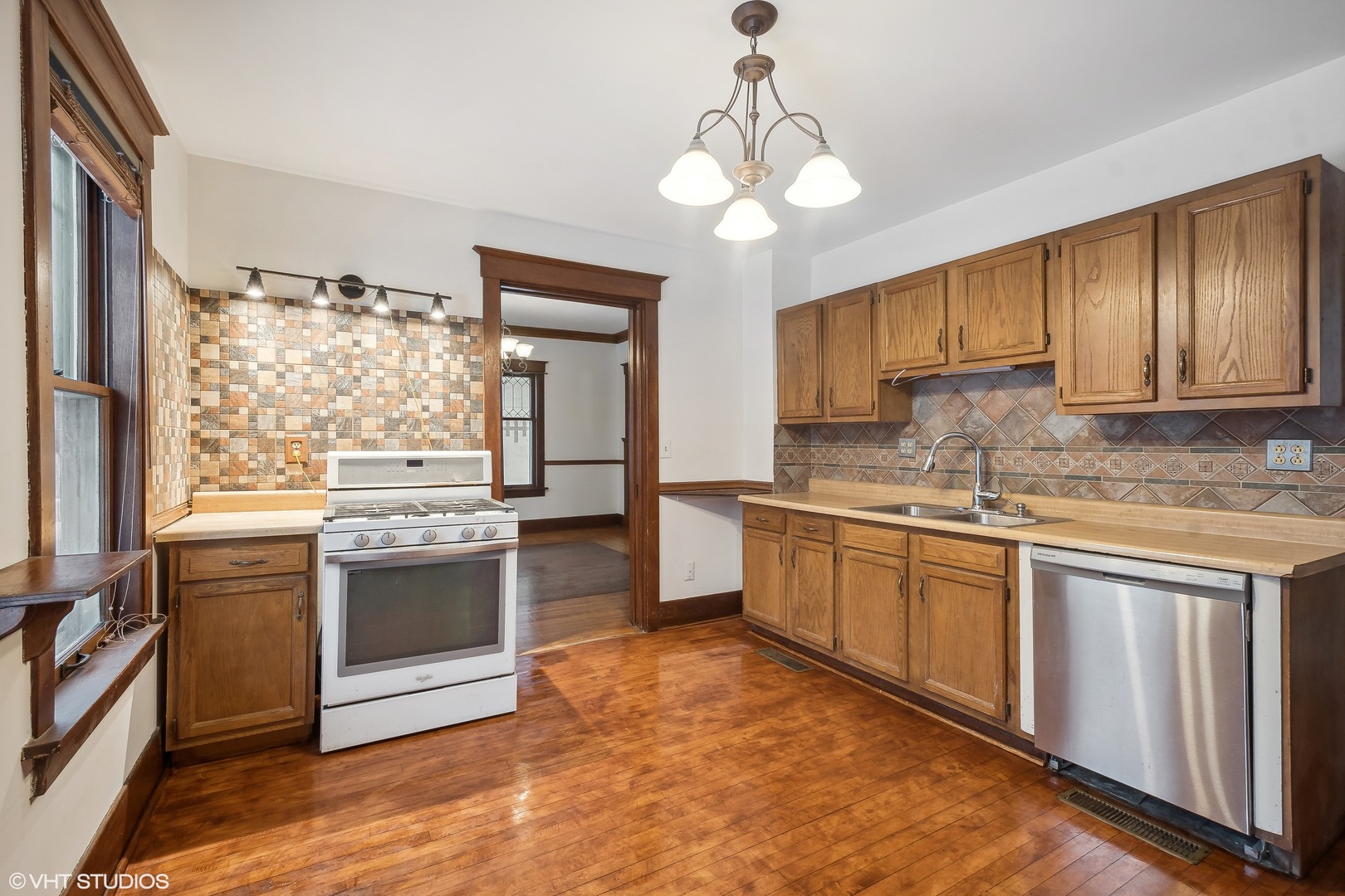 32 East Maple Avenue Roselle, IL 60172 - Photo 6 of 19 a kitchen with stainless steel appliances granite countertop a stove and a sink