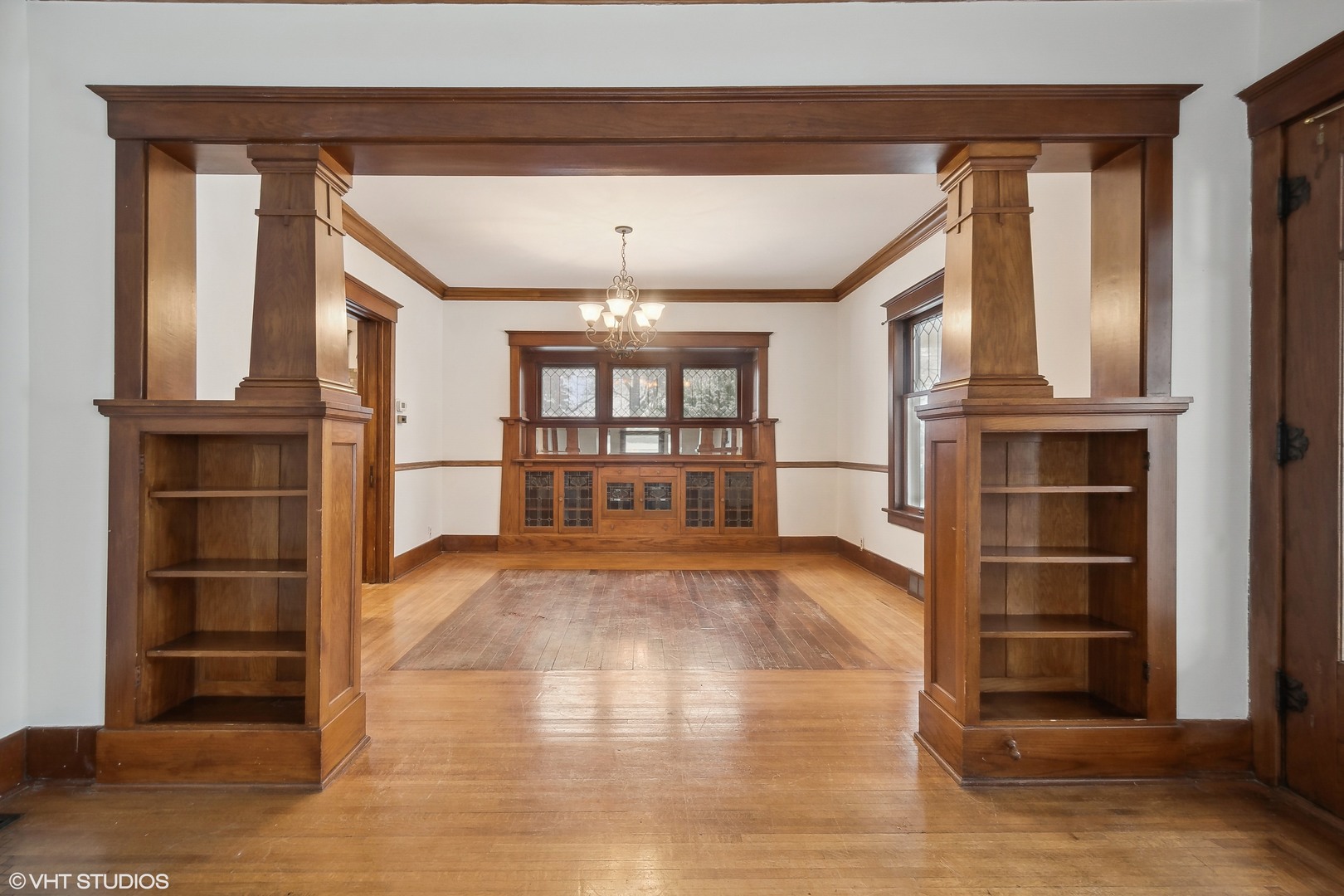 32 East Maple Avenue Roselle, IL 60172 - Photo 7 of 19 a view of empty room with wooden floor and windows