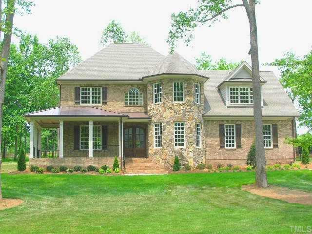 1812 Silver Mist Court Raleigh, NC 27613 - Photo 1 of 10 Handsome All Brick Home with Stone Accent on 1.01 Cul De Sac Lot. Wrap Porch, Large Screen Porch & Deck! Exterior Front
