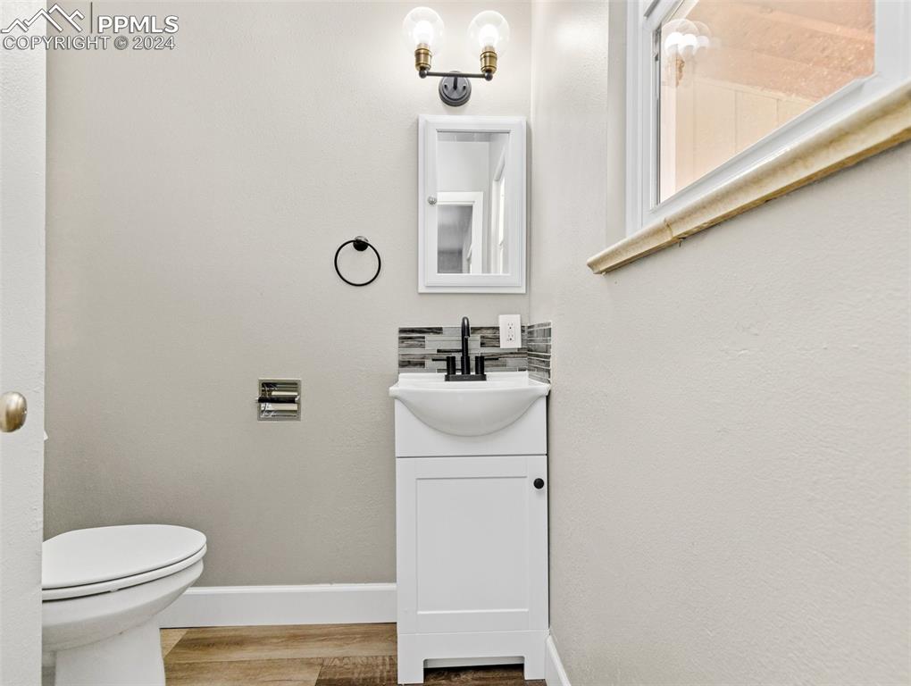 65 University Circle Pueblo, CO 81005 - Photo 17 of 32 a bathroom with a sink a mirror and a toilet
