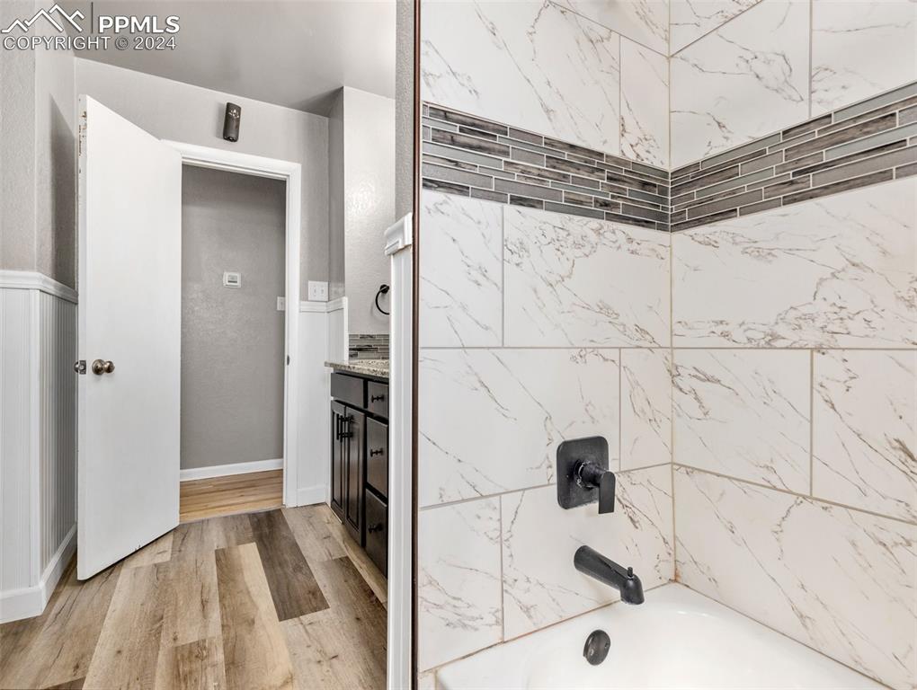 65 University Circle Pueblo, CO 81005 - Photo 19 of 32 a bathroom with a bathtub and shower