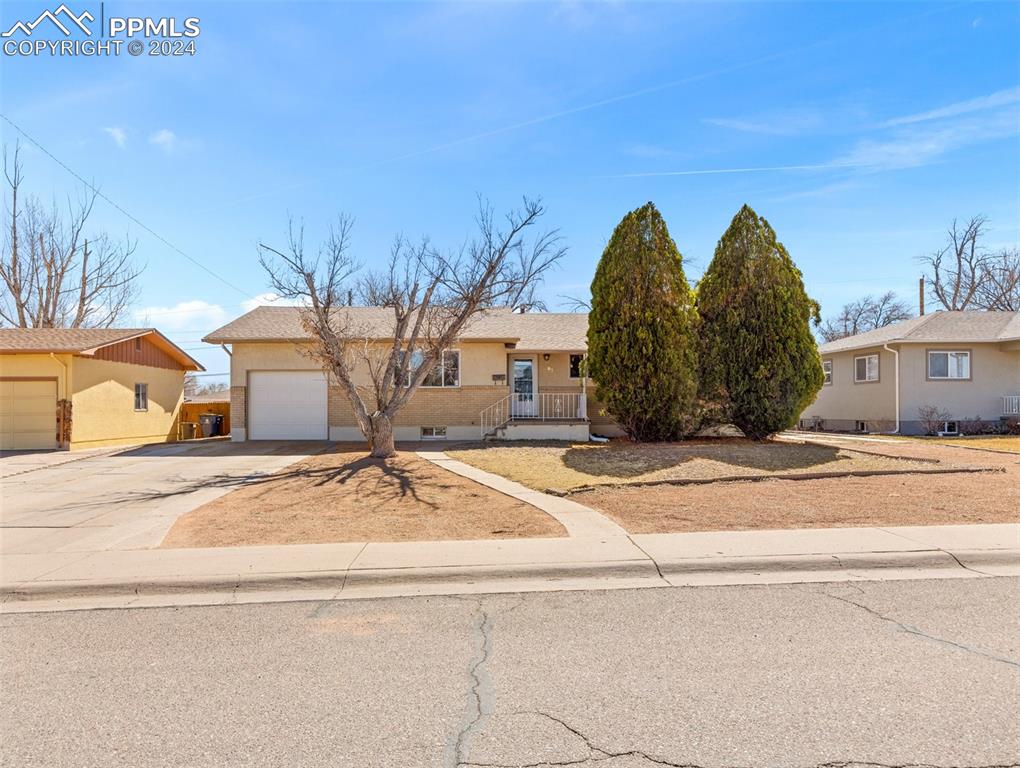 65 University Circle Pueblo, CO 81005 - Photo 2 of 32 a view of a houses with a road