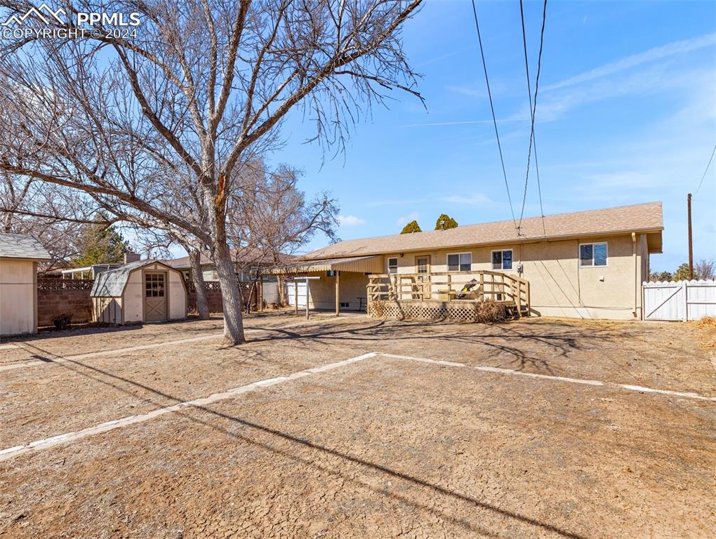 65 University Circle Pueblo, CO 81005 - Photo 27 of 32 a front view of a house with a yard and garage