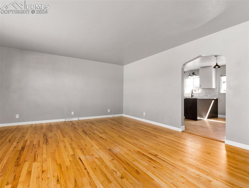 65 University Circle Pueblo, CO 81005 - Photo 8 of 32 a view of empty room with wooden floor and fireplace