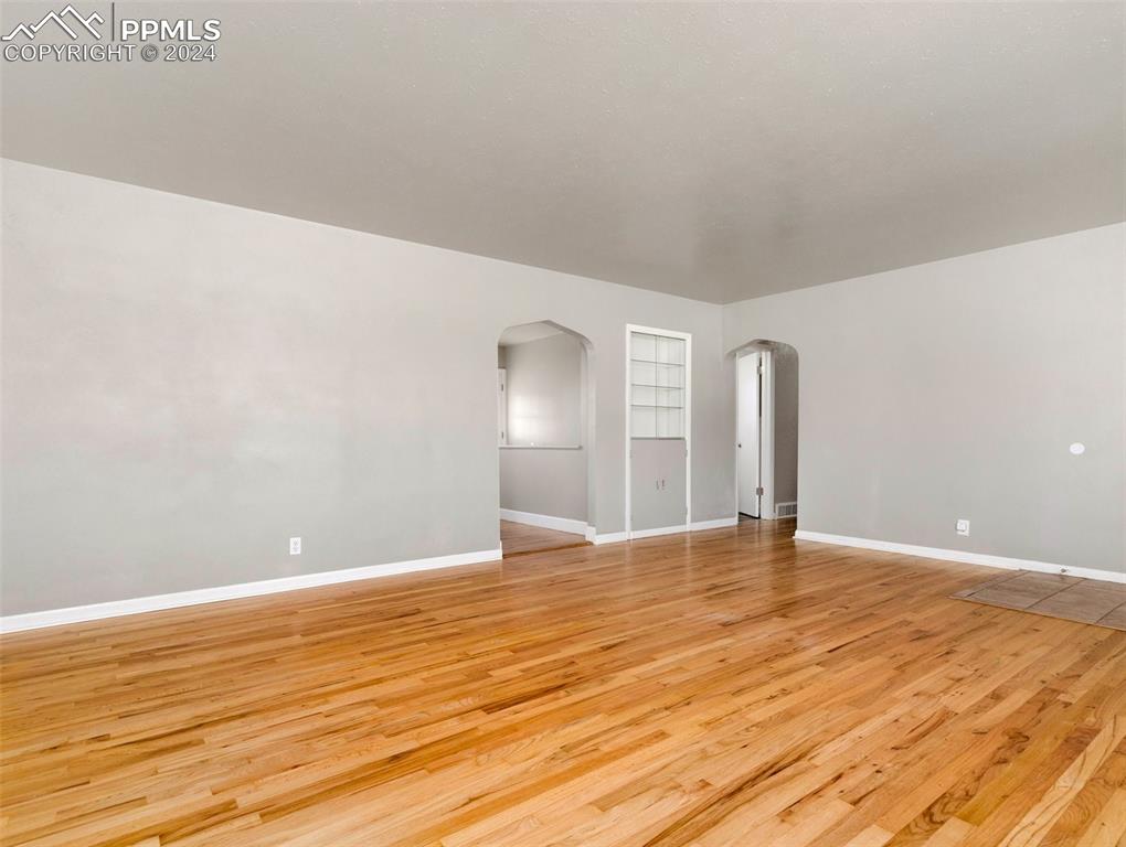 65 University Circle Pueblo, CO 81005 - Photo 9 of 32 a view of an empty room with wooden floor