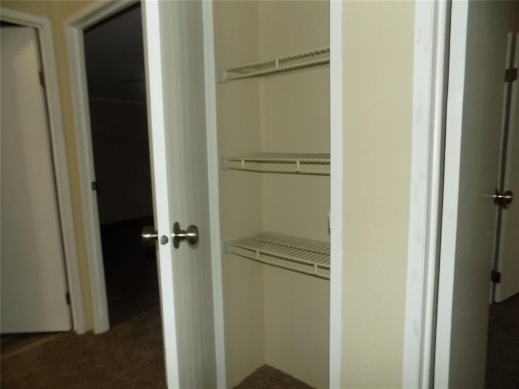 203 South Ridgeview Court Azle, TX 76020 - Photo 15 of 29 Linen closet to support the secondary bedrooms.