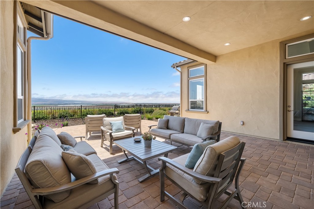 1630 Eucalyptus Road Nipomo, CA 93444 - Photo 16 of 75 a living room with furniture and a floor to ceiling window