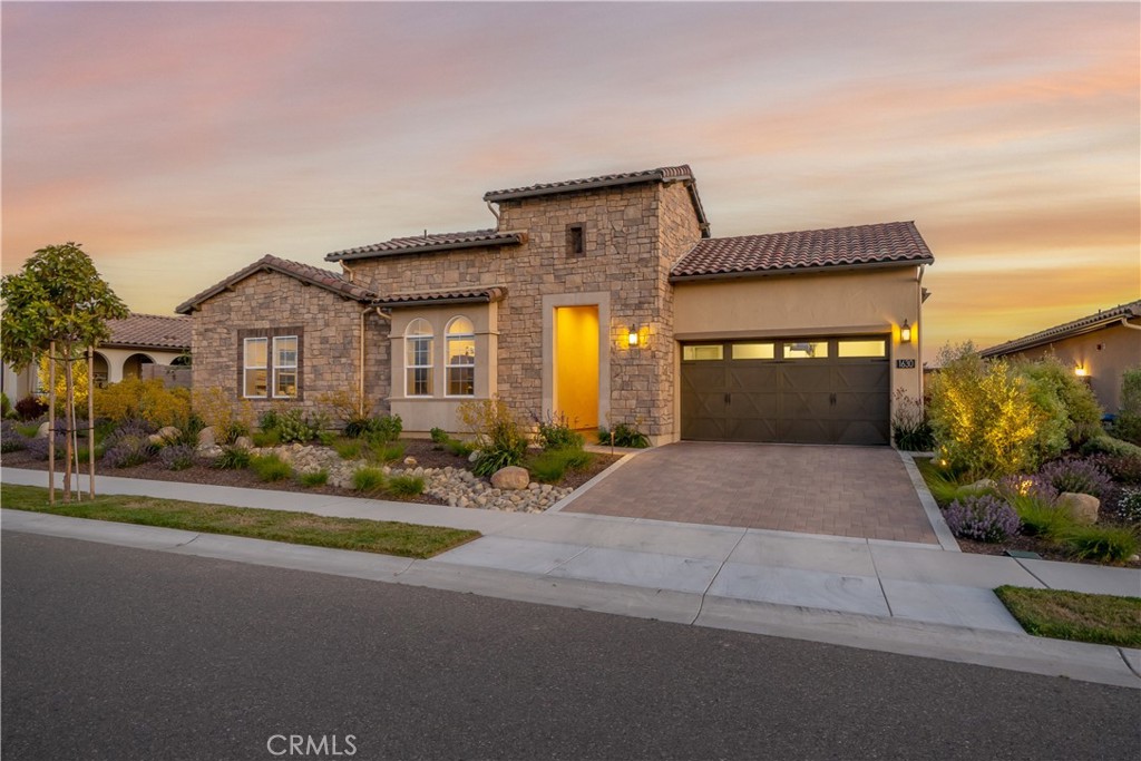 1630 Eucalyptus Road Nipomo, CA 93444 - Photo 2 of 75 a front view of a house with a yard and garage