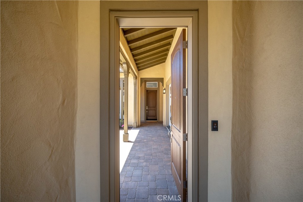 1630 Eucalyptus Road Nipomo, CA 93444 - Photo 3 of 75 a view of a hallway with a wooden door