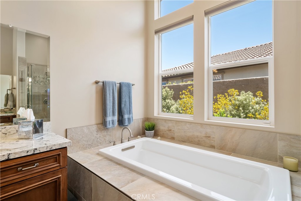 1630 Eucalyptus Road Nipomo, CA 93444 - Photo 33 of 75 a bathroom with a granite countertop tub and a sink
