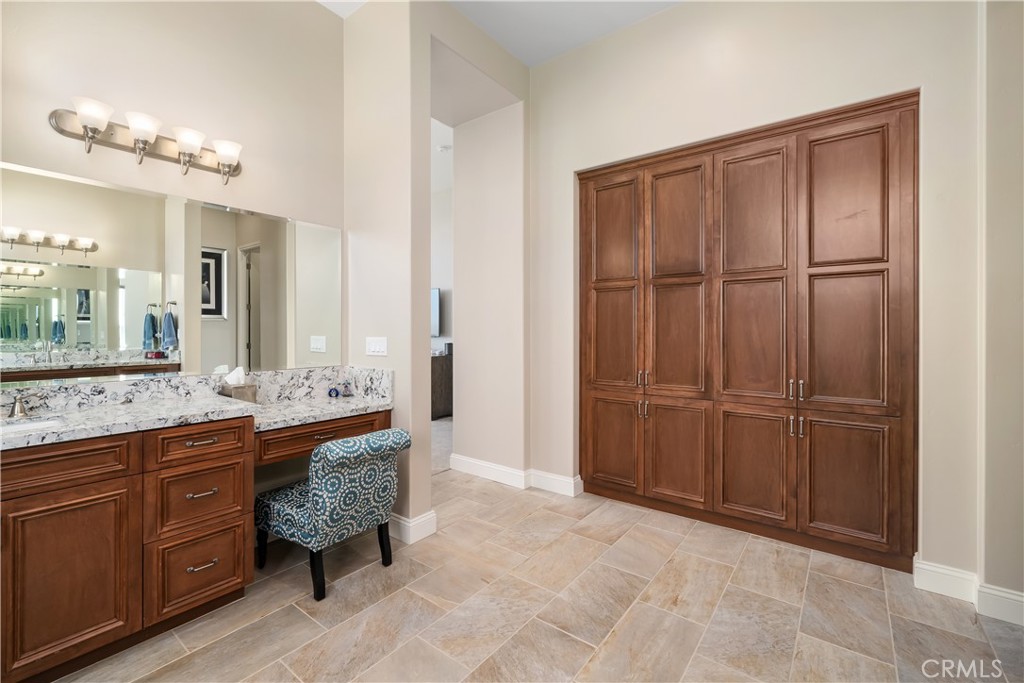 1630 Eucalyptus Road Nipomo, CA 93444 - Photo 34 of 75 a spacious bathroom with a granite countertop sink a mirror and a shower