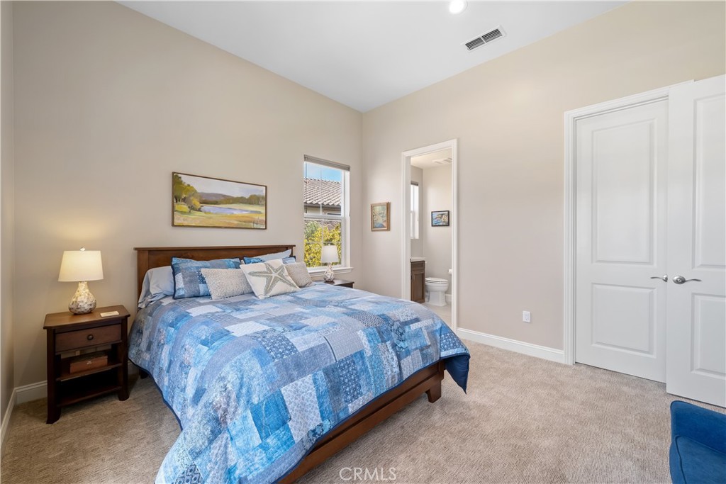 1630 Eucalyptus Road Nipomo, CA 93444 - Photo 44 of 75 a bedroom with a bed and a painting