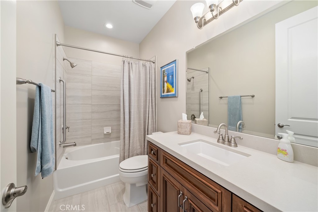 1630 Eucalyptus Road Nipomo, CA 93444 - Photo 49 of 75 a bathroom with a sink a toilet and shower