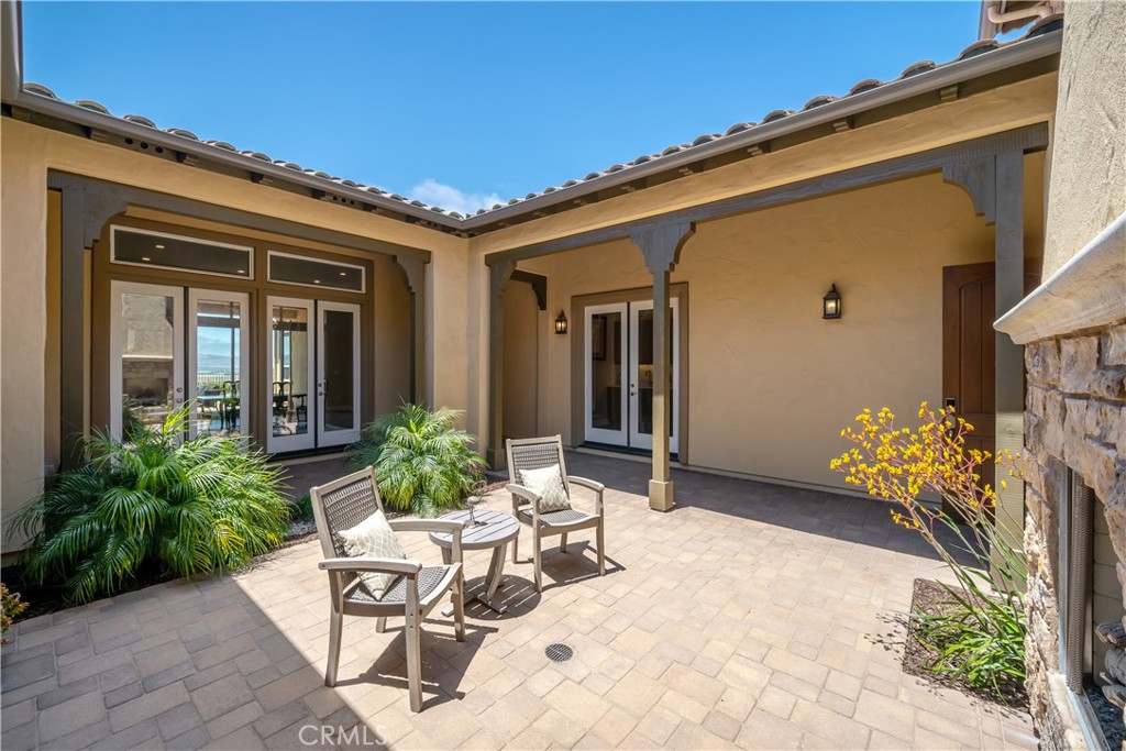 1630 Eucalyptus Road Nipomo, CA 93444 - Photo 5 of 75 a view of a patio with table and chairs and potted plants