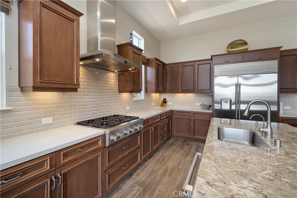 1630 Eucalyptus Road Nipomo, CA 93444 - Photo 9 of 75 a kitchen with stainless steel appliances granite countertop a stove a sink and a microwave
