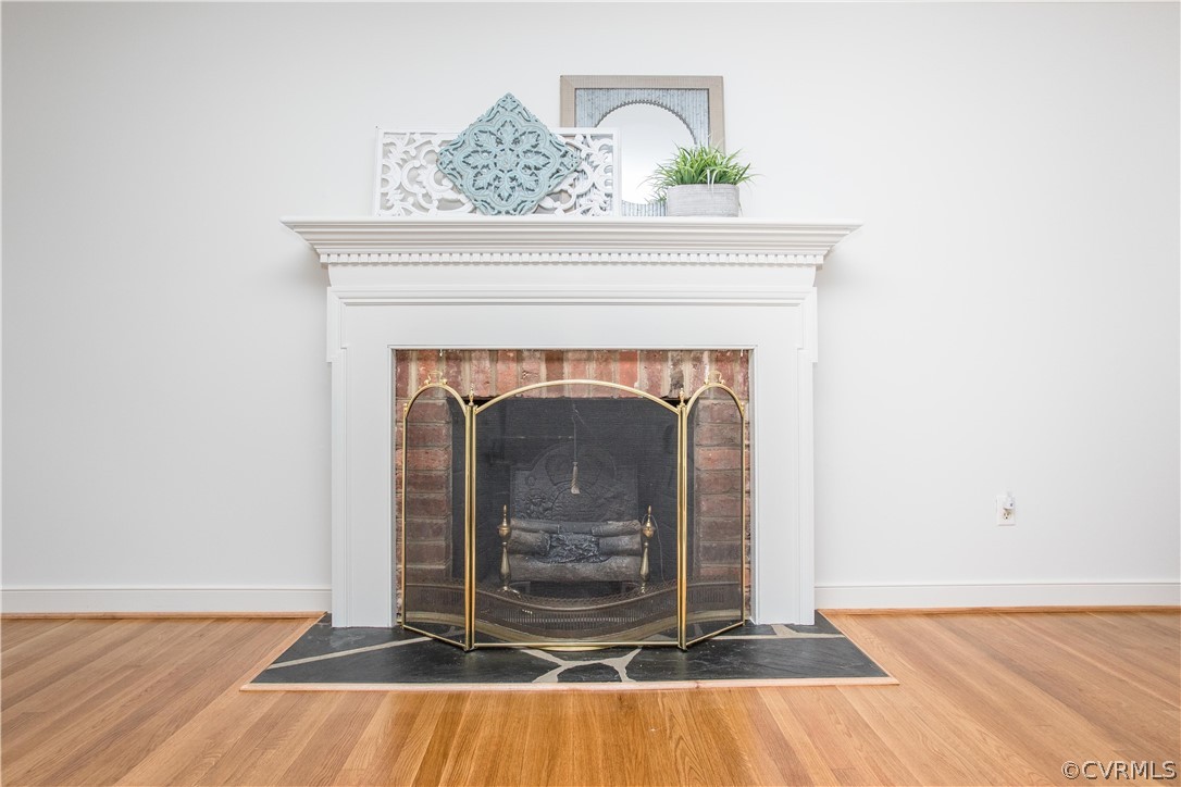 12912 Silver Crest Road Chester, VA 23831 - Photo 14 of 45 a view of a fireplace with wooden floor