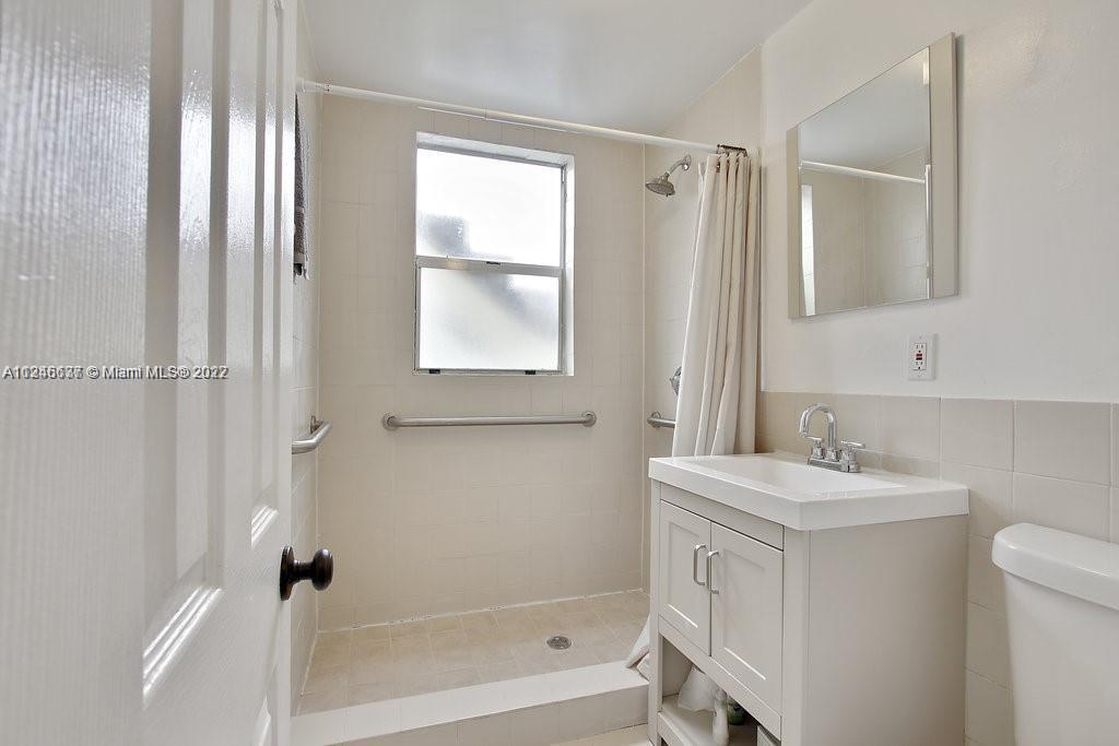 154 Southwest 18th Court Miami, FL 33135 - Photo 9 of 9 a bathroom with a sink a toilet and shower