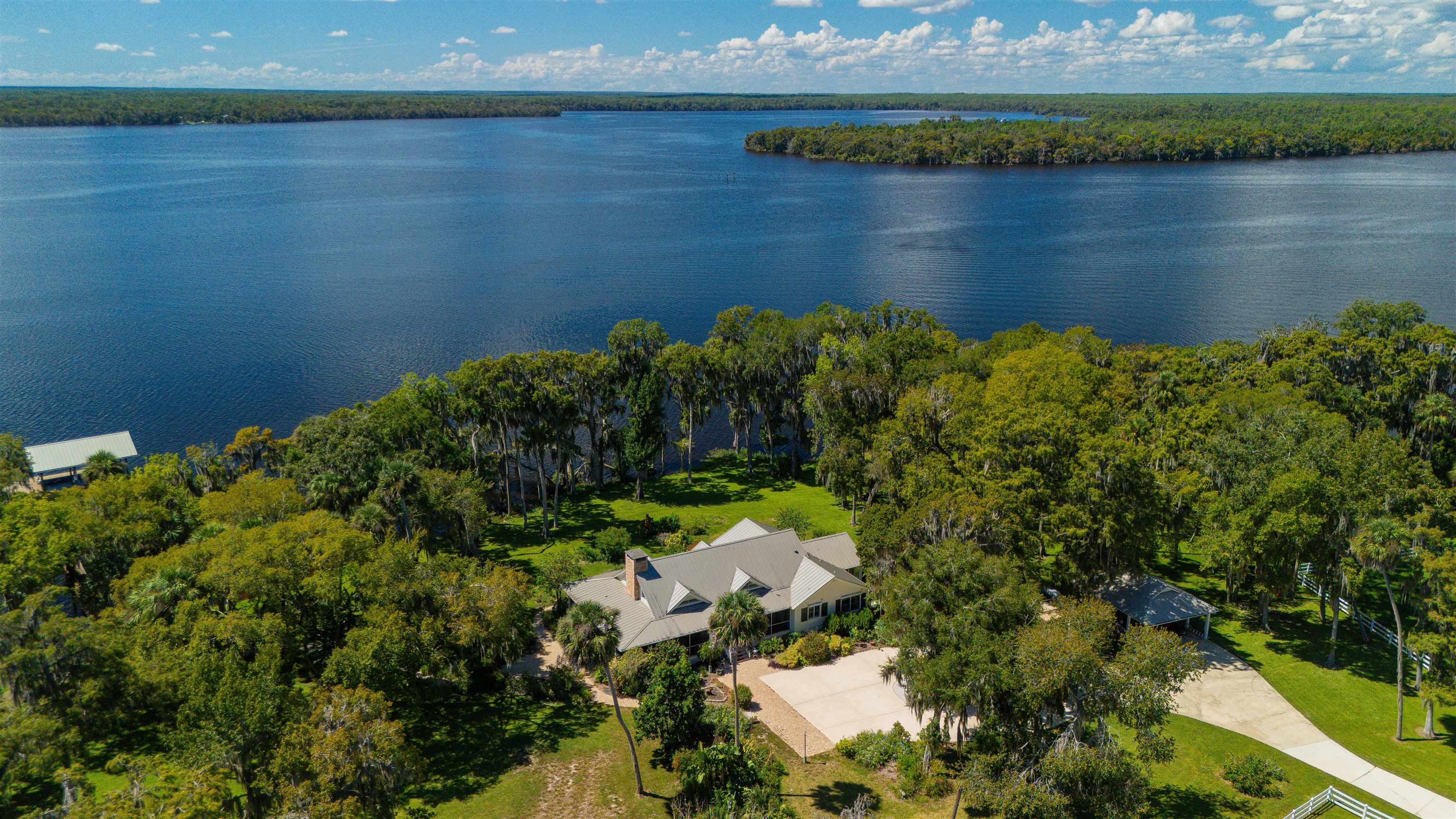 141 Wooten Rd Crescent Crescent City, FL 32112 - Photo 1 of 72 a view of a lake with a lake