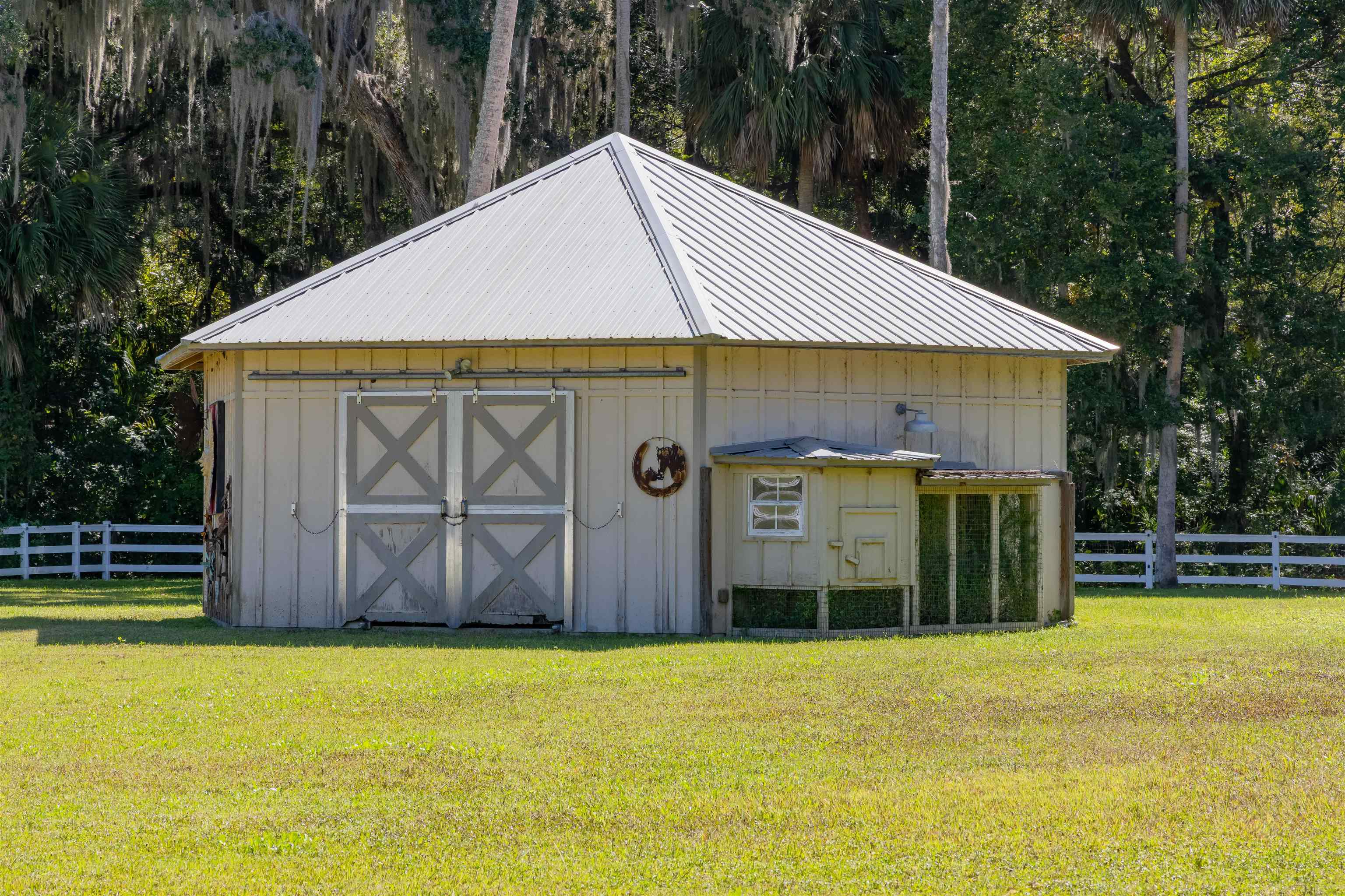 141 Wooten Rd Crescent Crescent City, FL 32112 - Photo 15 of 72 a view of a house with backyard and tree