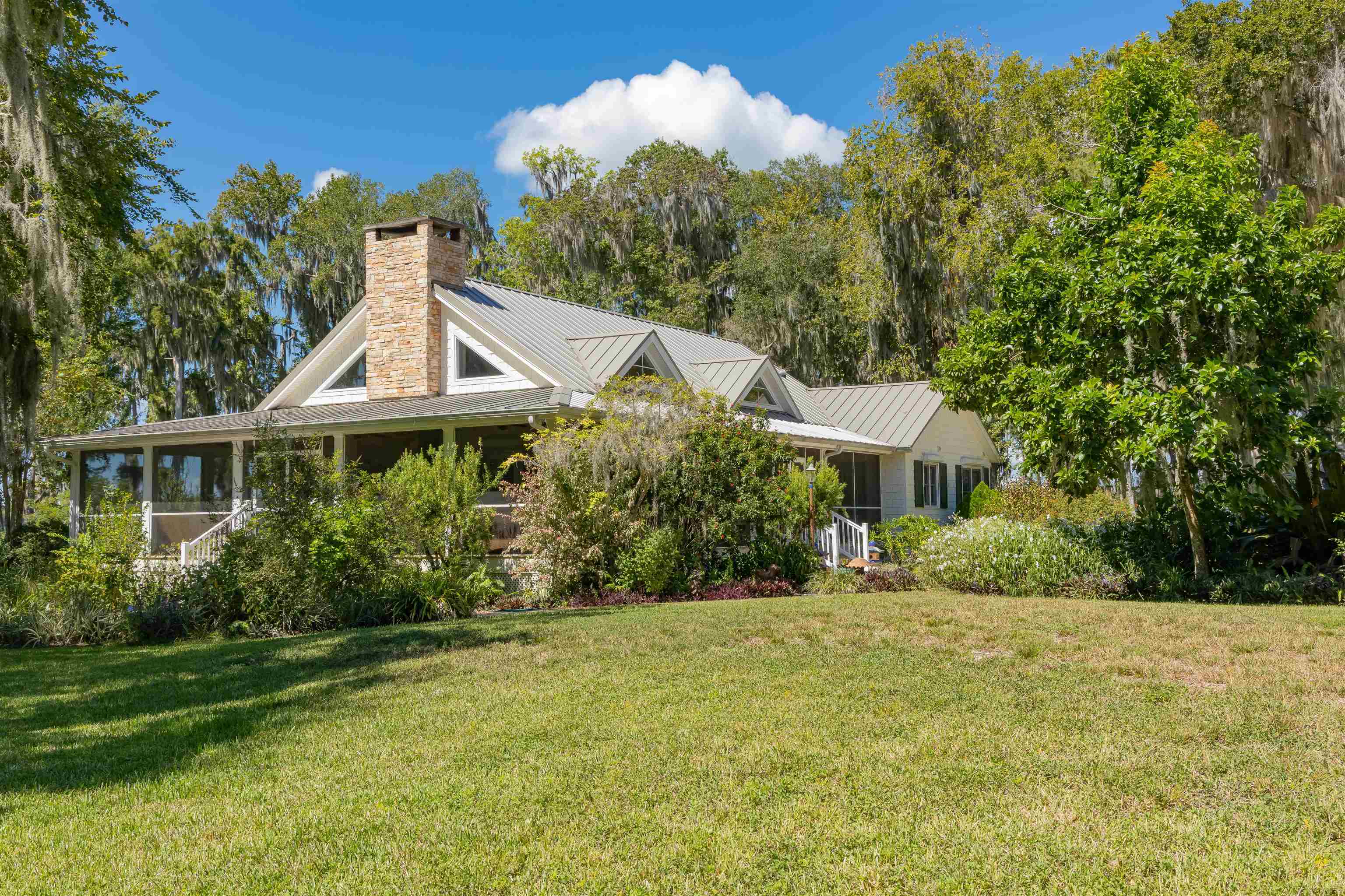 141 Wooten Rd Crescent Crescent City, FL 32112 - Photo 25 of 72 a front view of a house with a yard