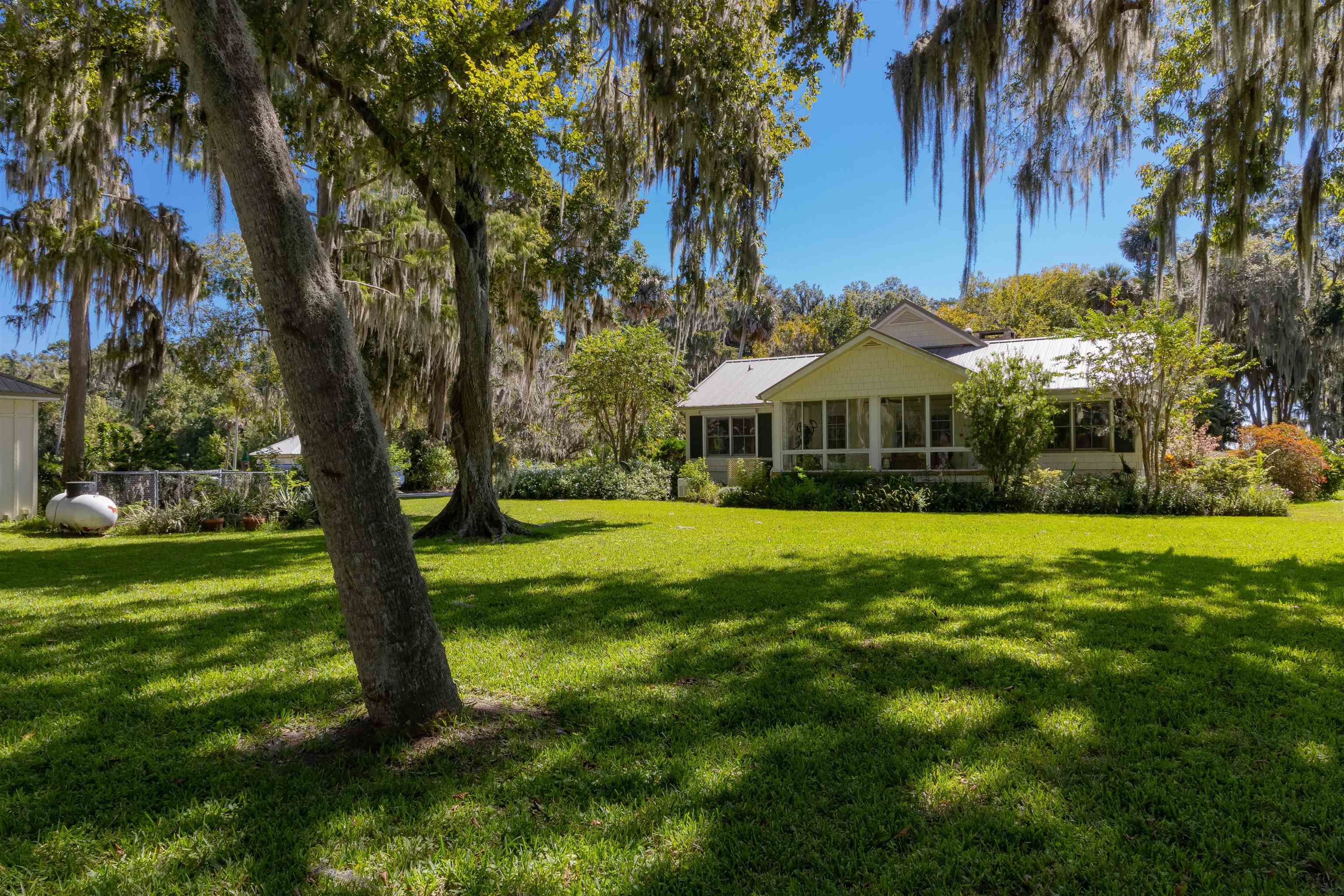 141 Wooten Rd Crescent Crescent City, FL 32112 - Photo 37 of 72 a front view of house with yard and green space
