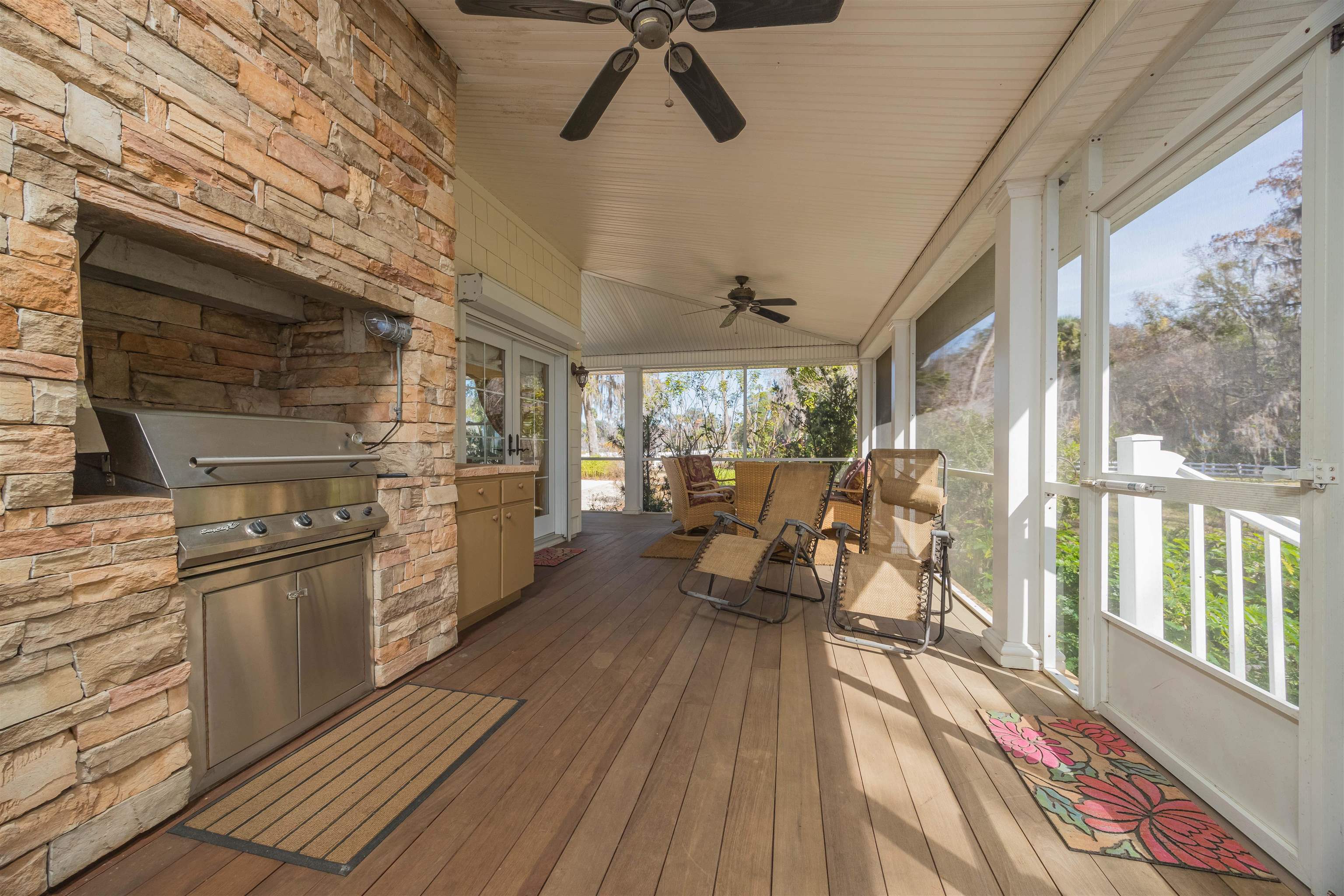 141 Wooten Rd Crescent Crescent City, FL 32112 - Photo 43 of 72 a living room with stainless steel appliances granite countertop furniture wooden floor and a large window