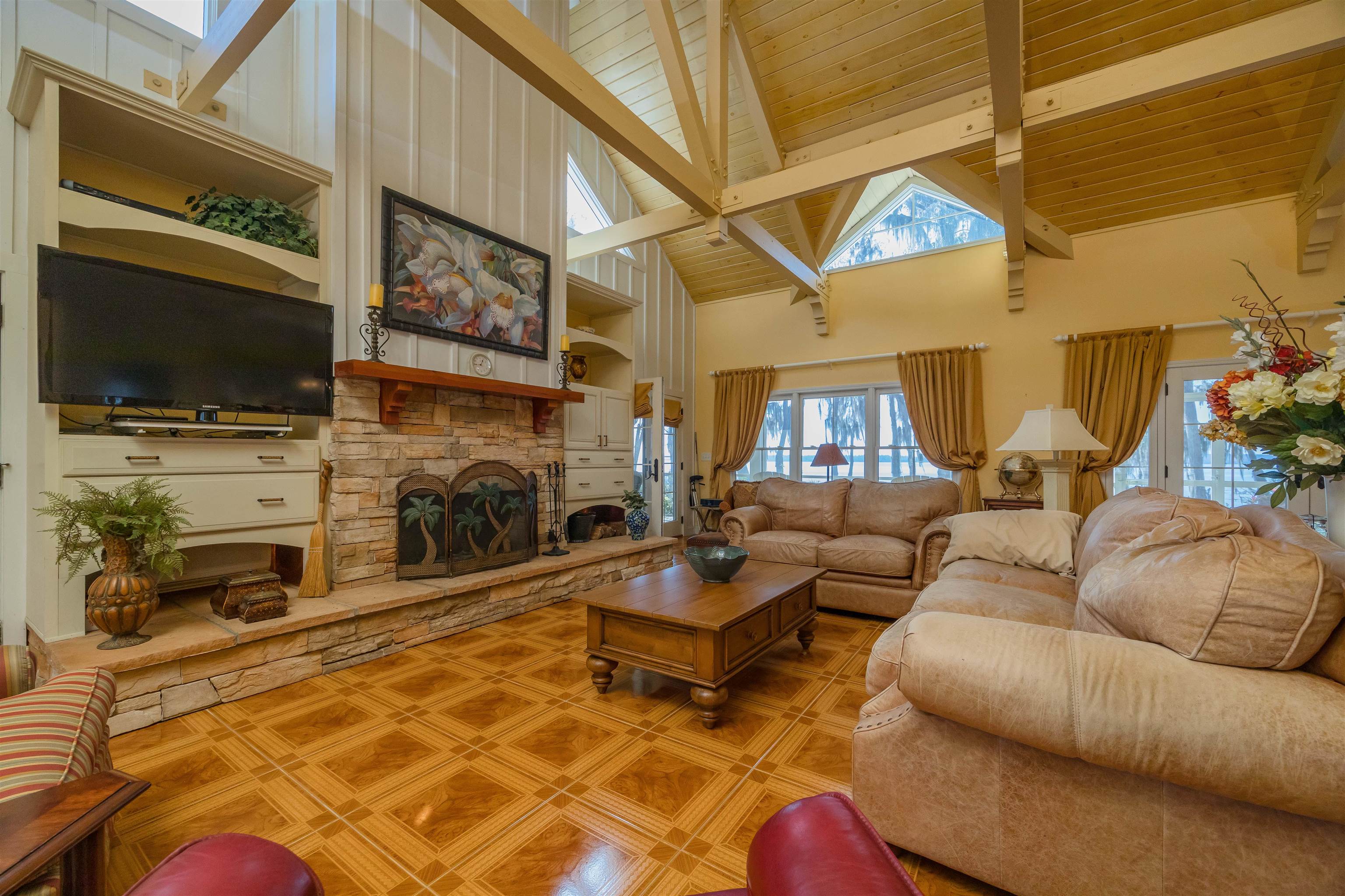 141 Wooten Rd Crescent Crescent City, FL 32112 - Photo 47 of 72 a living room with furniture a flat screen tv and a fireplace